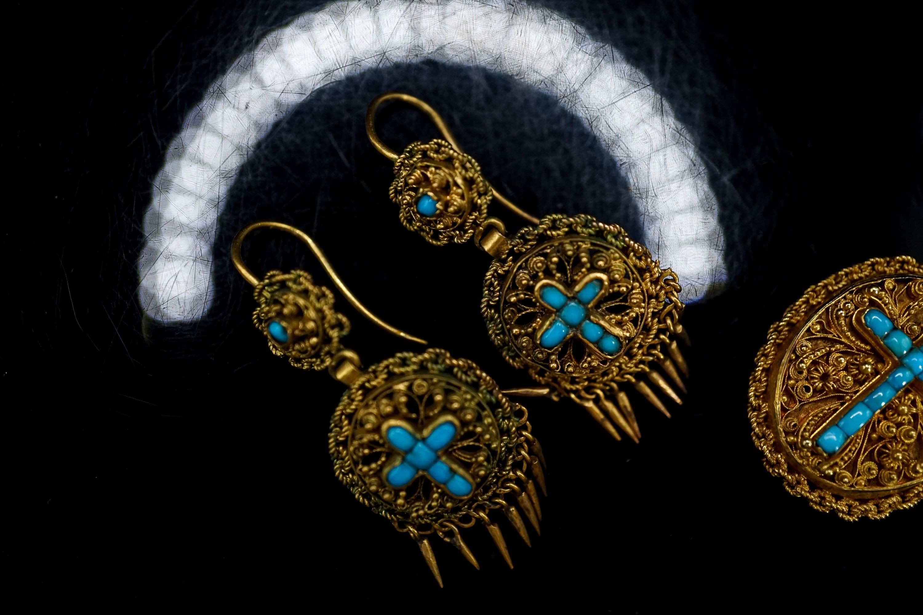 A Victorian yellow metal and turquoise set oval memorial pendant, 24mm, gross 7.5 grams and a pair of similar gilt metal tassel drop earrings.